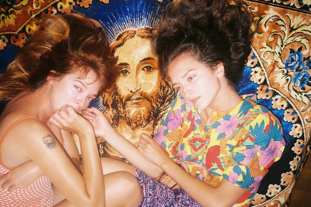 An artistic film photograph of two women and Jesus, by Lukasz Wierzbowski, featured in Variant Journal.